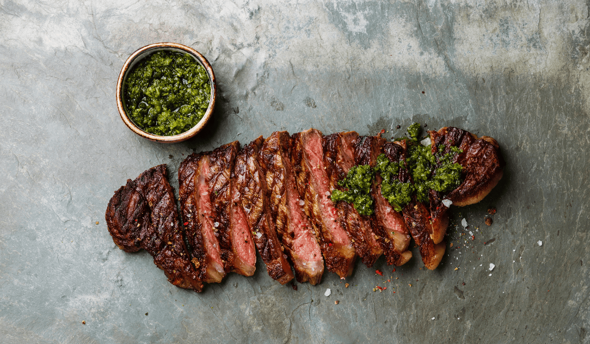 Texas de Brazil signature dishes Picanha (Top Sirloin), Flank Steak, Lamb Chops, Brazilian Sausage, Extensive Salad Bar Selections (Lobster Bisque often highlighted).